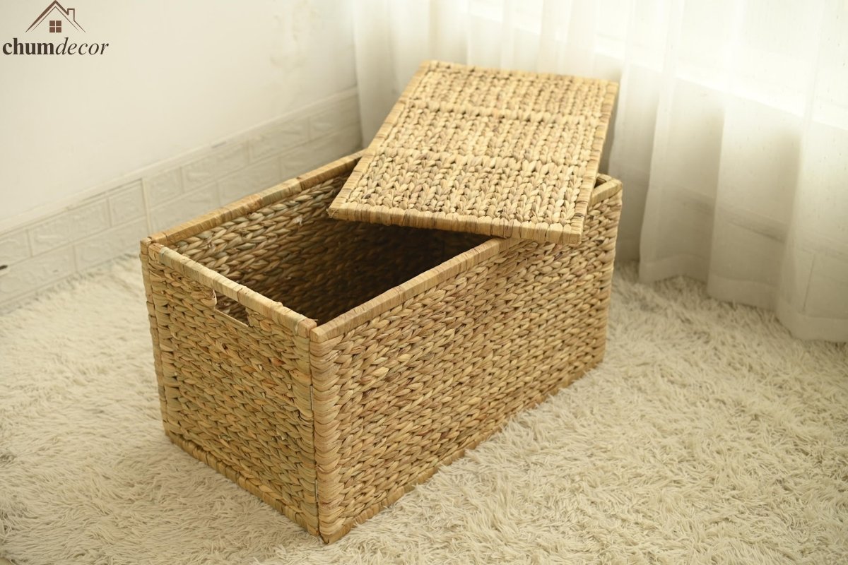 Open Wicker Storage Trunk Showing Interior Capacity Open wicker storage trunk with lid propped up, revealing spacious interior on a soft shag rug.