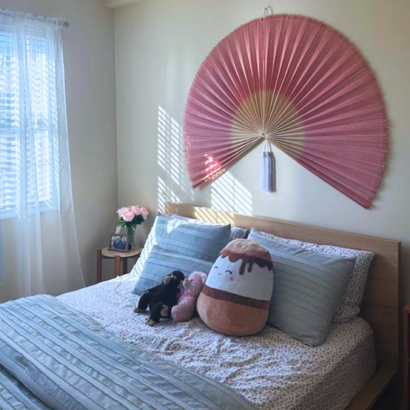 Pink Bamboo Wall Fan in Playful Kids Room
