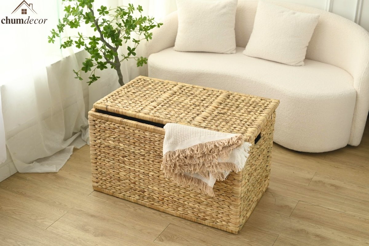 Wicker Storage Trunk Decorated with Throw Blanket Wicker storage trunk with a boho throw blanket draped over the side in a cozy living room.