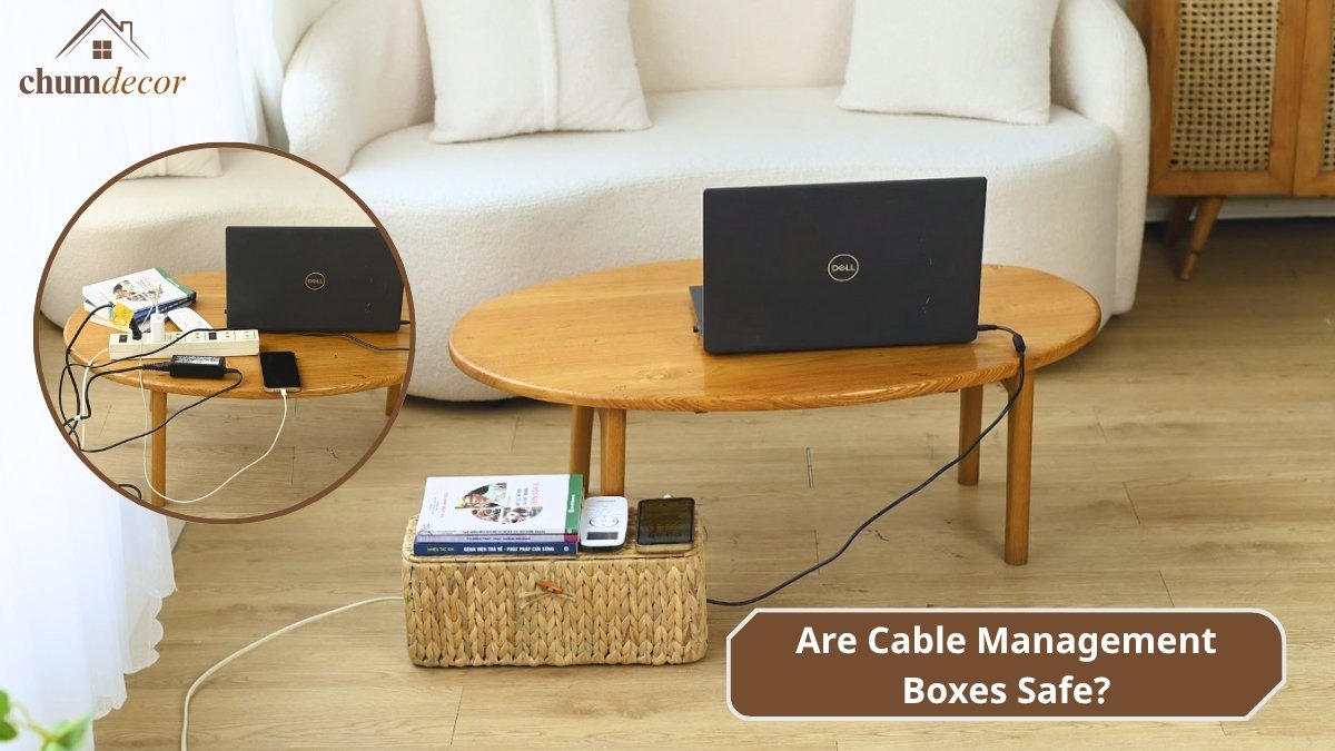 A decorative cable management box on a wooden floor, showing how it safely hides wires near a sofa.