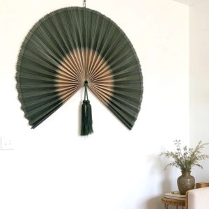 Oversized Forest Green Bamboo Fan Above Bed