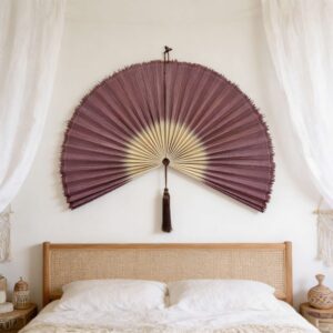 red bamboo wall fan above bed.jpg